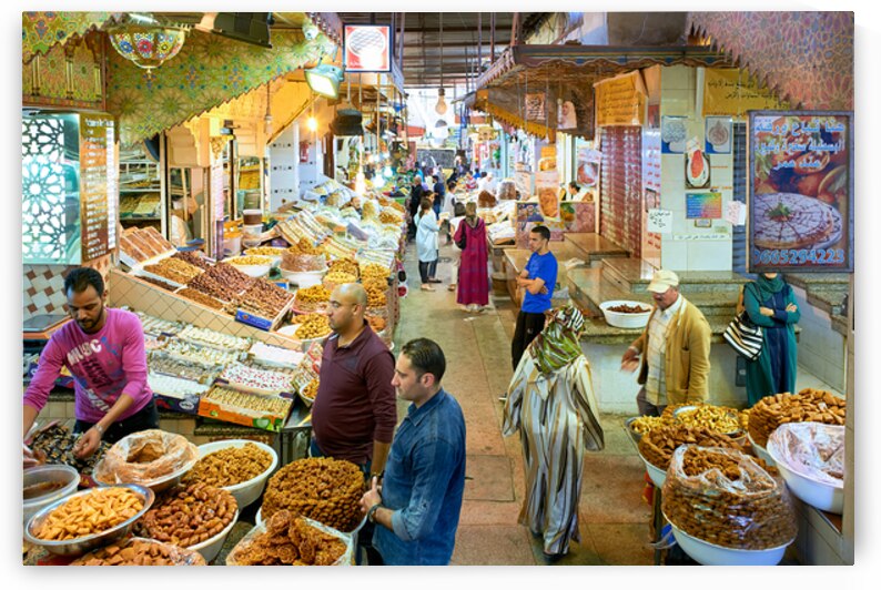 Exploring the souk in Meknes Morocco with vendors and shoppers by Marco Brivio