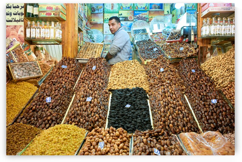 Dried fruit market in Meknes Morocco during busy shopping hours by Marco Brivio