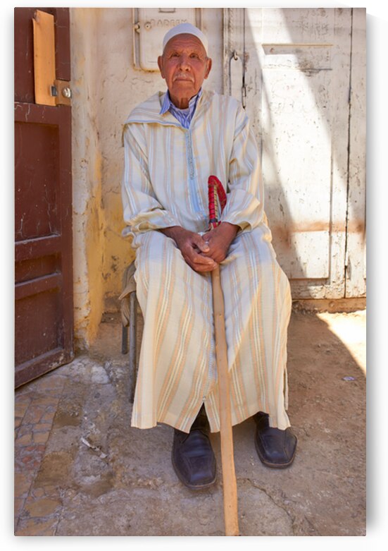 Old man sitting in Meknes Morocco in daylight by Marco Brivio