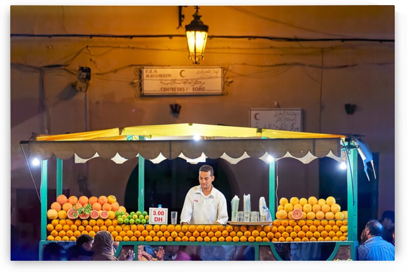 Orange juice stall in Marrakesh with fresh fruits at night by Marco Brivio
