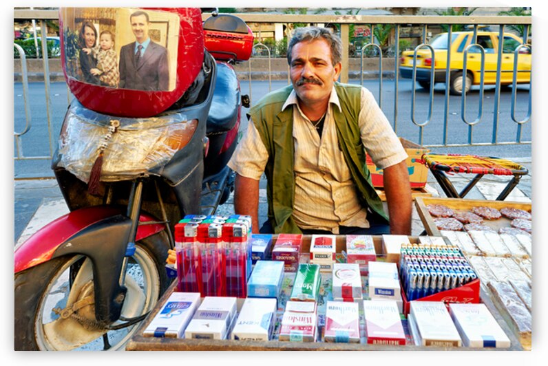 Man selling cigarettes near his motorcycle in Damascus Syria by Marco Brivio