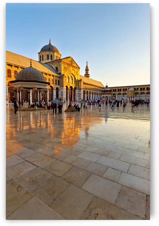 Visitors gather at the Umayyad Mosque in Damascus during sunset by Marco Brivio
