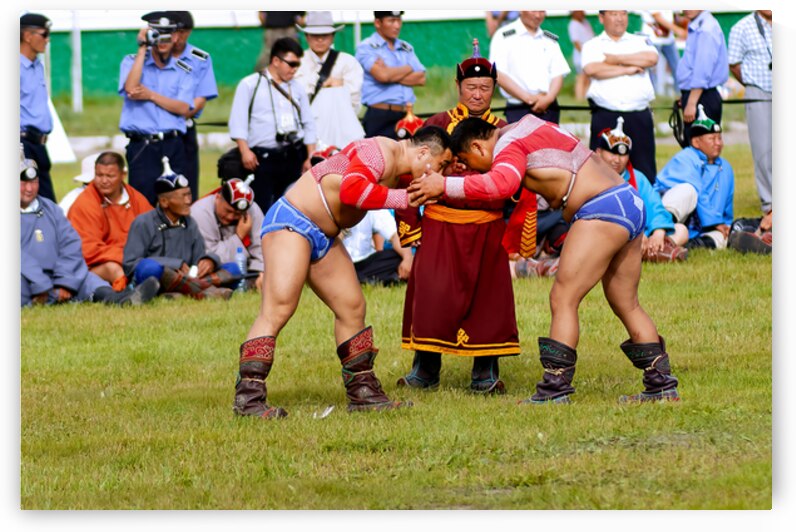 Wrestling matches take place during Naadam festival in Ulaanbaat by Marco Brivio