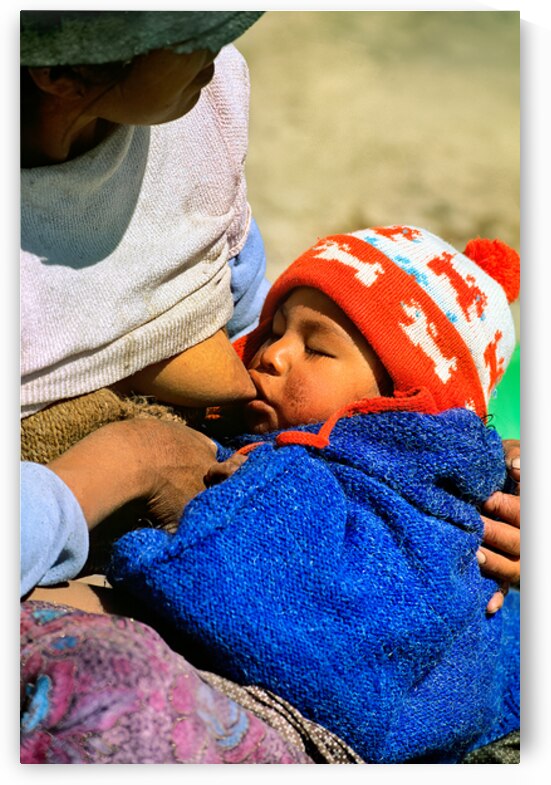Indigenous mother nourishes child in the Andes of Argentina by Marco Brivio