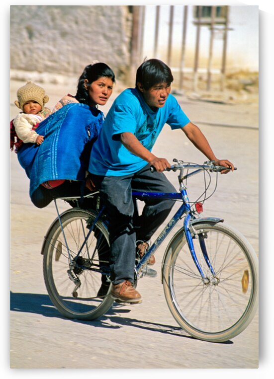 Family cycling with baby in sling. by Marco Brivio