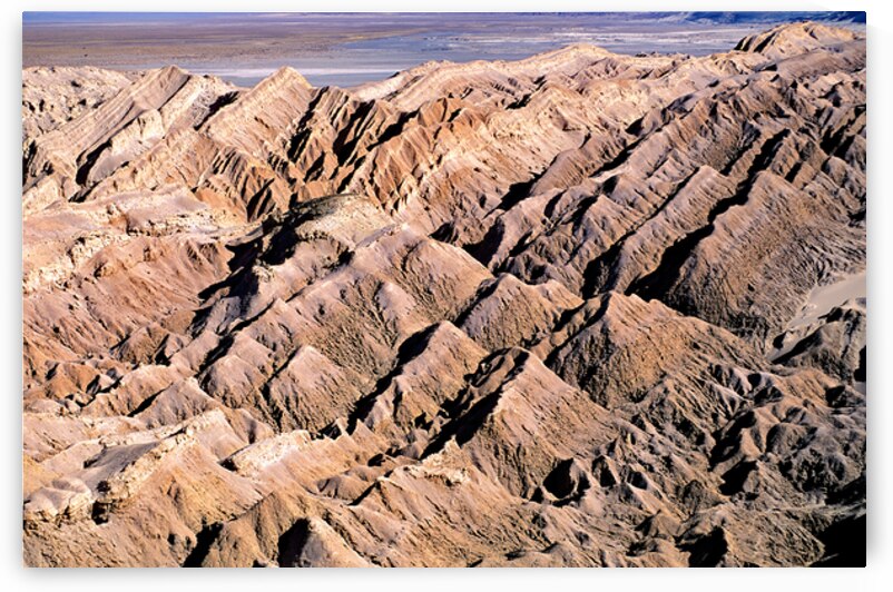 Striking patterns of eroded desert hills and valleys. by Marco Brivio