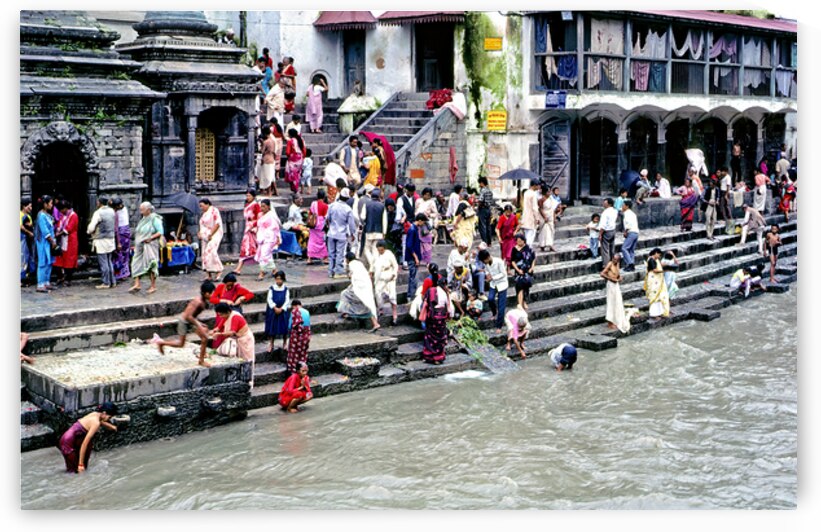 People gather at Pashupatinath for rituals by the river in Kathm by Marco Brivio