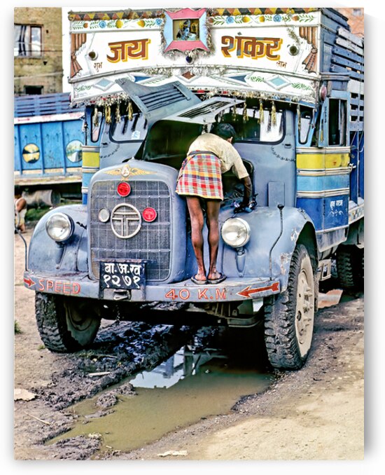 Repairing a truck in Kathmandu Nepal during the daytime by Marco Brivio