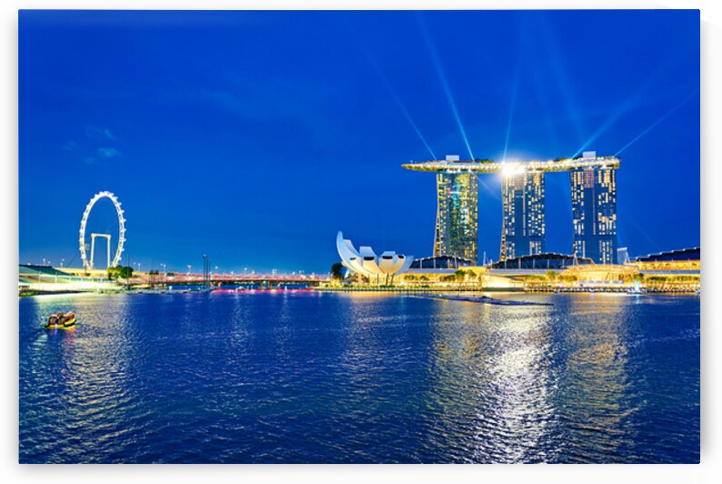 Sunset view of Marina Bay with city skyline and water reflection by Marco Brivio