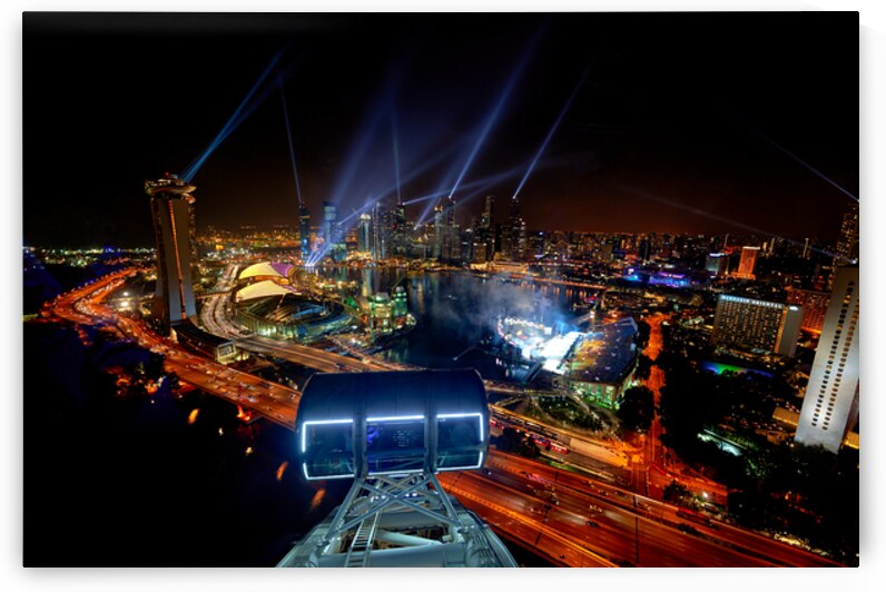 View of Singapore city at night from the Flyer with shining ligh by Marco Brivio