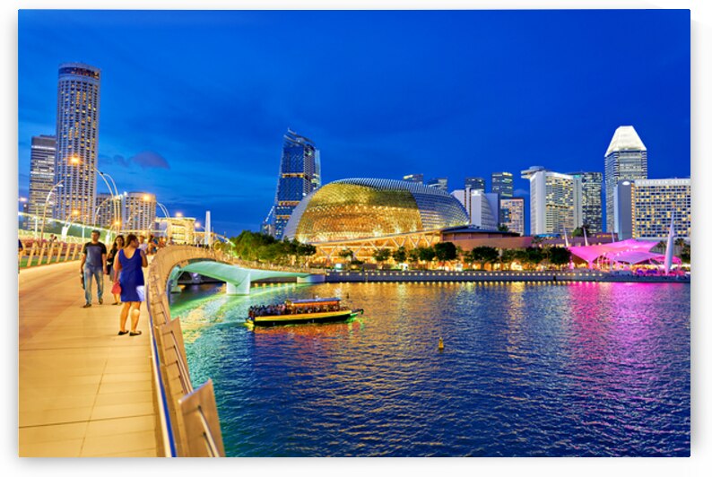 People walk by Marina Bay waterfront as city lights turn on at s by Marco Brivio
