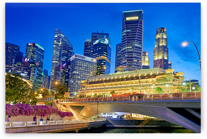 People walk by the waterfront in Marina Bay during sunset in Sin by Marco Brivio