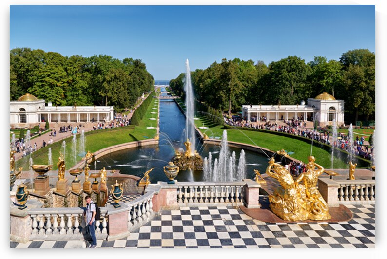 People walk and admire the fountains at Peterhof Palace in St by Marco Brivio