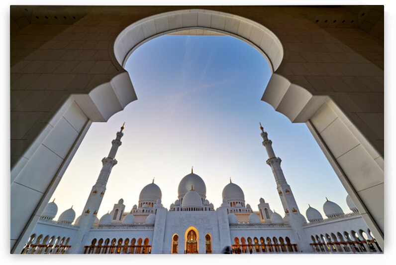 Sheikh Zayed Grand Mosque viewed from an arch at sunset by Marco Brivio
