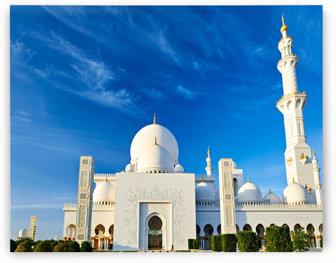 Abu Dhabi mosque stands tall under blue sky by Marco Brivio