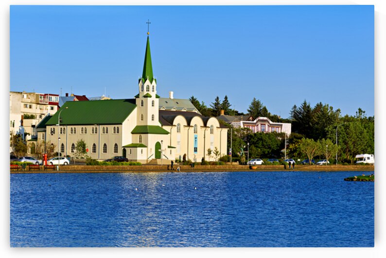 Lutheran Free Church near Lake Tjornin in Reykjavik Iceland by Marco Brivio