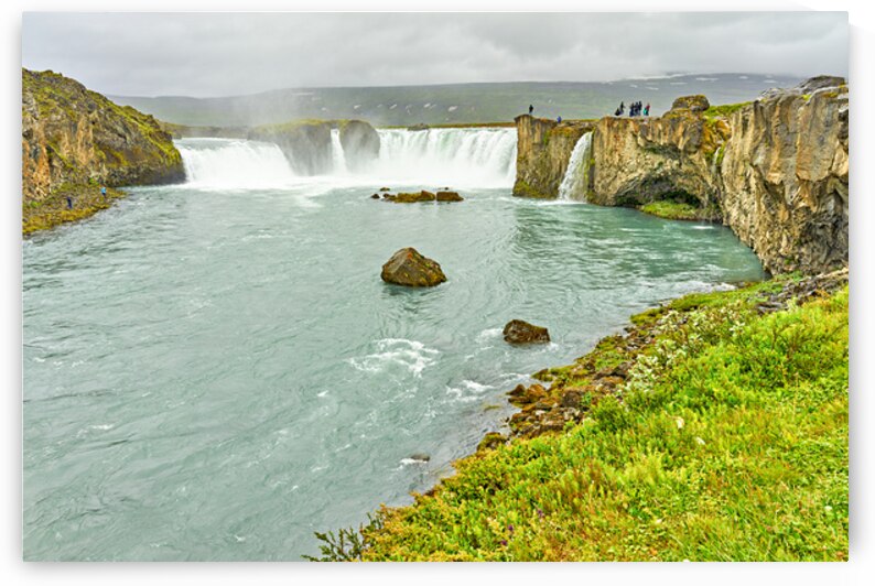 Exploring Godafoss waterfall in Iceland on a cloudy day by Marco Brivio
