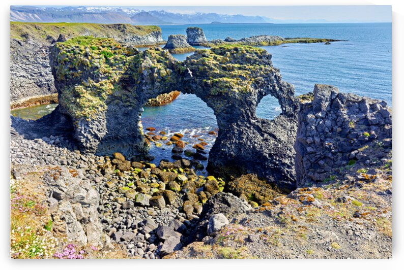 Exploring arnarstapi cliff in Iceland by the ocean by Marco Brivio