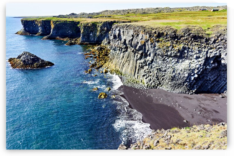View of Arnarstapi cliffs and black sand beach in Iceland by Marco Brivio