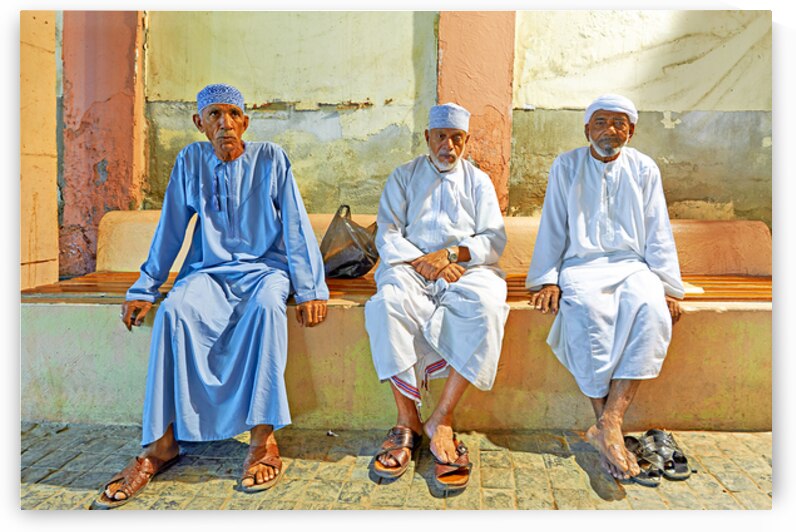 Men sitting together at Mutrah Souq in Muscat Oman by Marco Brivio