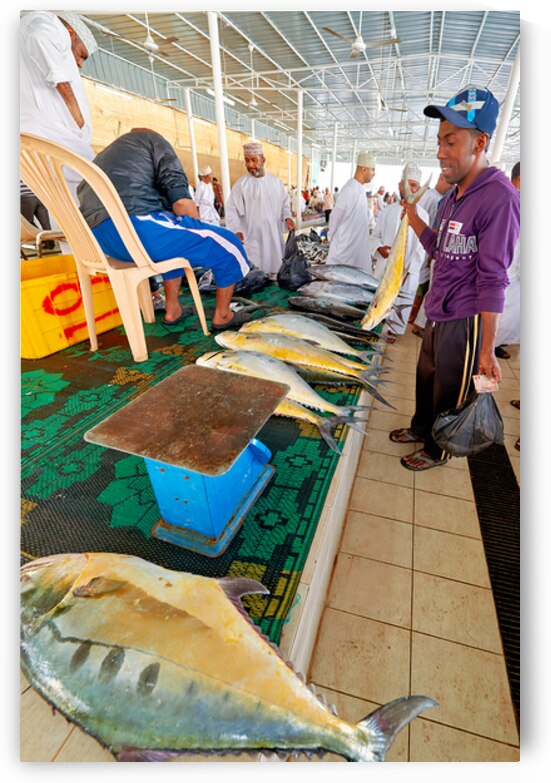 Fish market in Muscat Oman shows local vendors and buyers by Marco Brivio