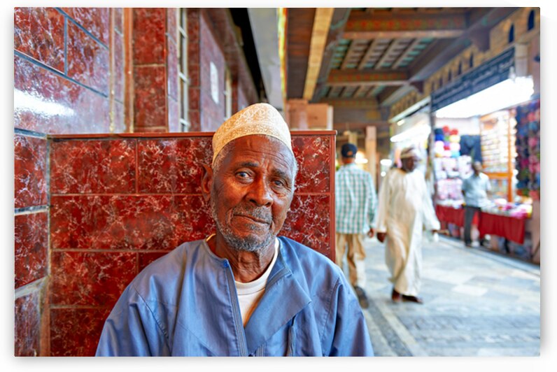 Elderly man resting at the Mutrah Souq in Muscat Oman by Marco Brivio
