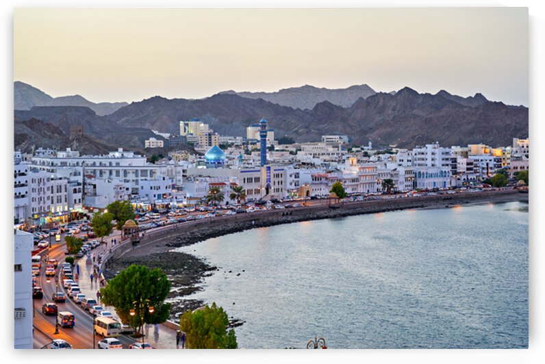 Waterfront cityscape view of Muscat Oman at dusk by Marco Brivio