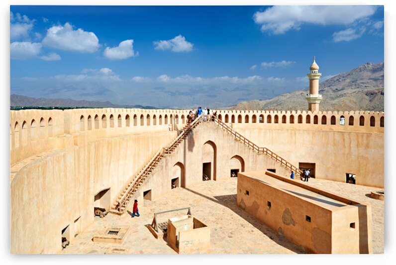 Visit to Nizwa Fort in Oman with visitors and open sky by Marco Brivio