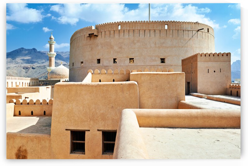 Visitors explore Nizwa Fort a historic site in Oman by Marco Brivio