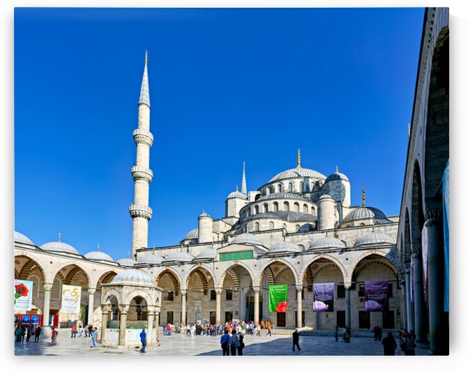 People walk around the Blue Mosque in Istanbul Turkey by Marco Brivio