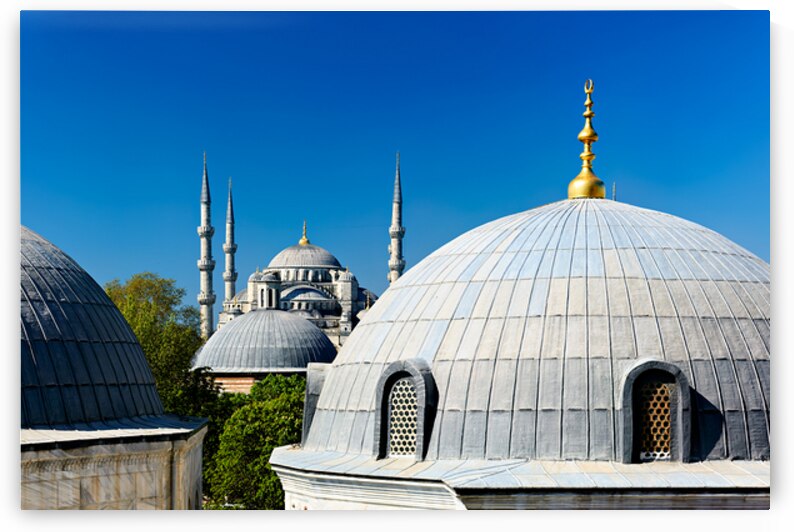 Blue Mosque domes under clear sky in Istanbul by Marco Brivio