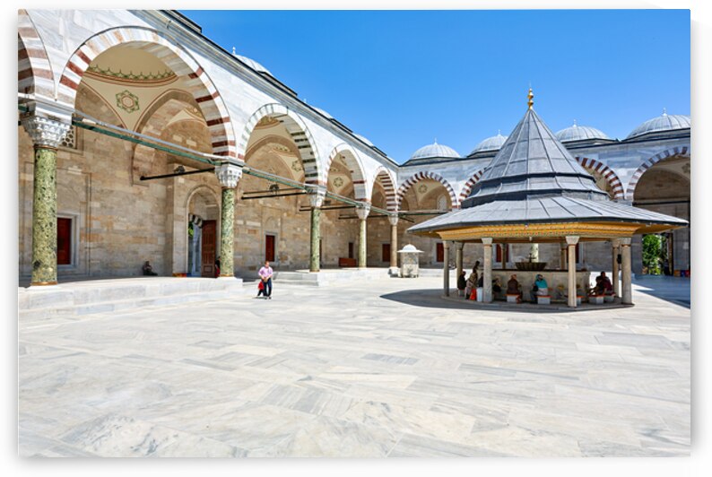 Visitors explore the courtyard at Fatih Mosque in Istanbul by Marco Brivio