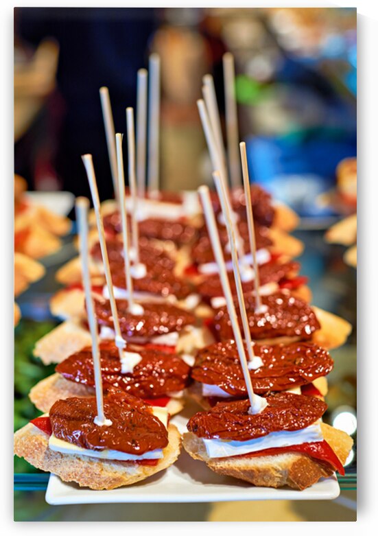 Enjoying tasty tapas in a bar in Barcelona Spain by Marco Brivio