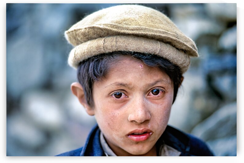 Young boy at Shandur Pass in Pakistan during daytime by Marco Brivio