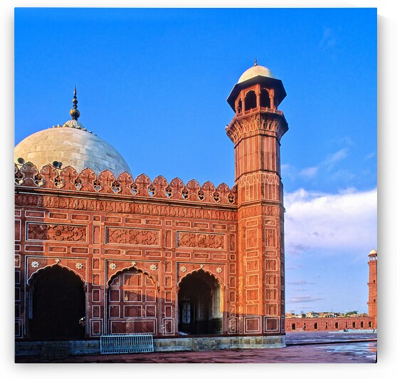 Badshahi mosque stands in Lahore under clear blue sky by Marco Brivio