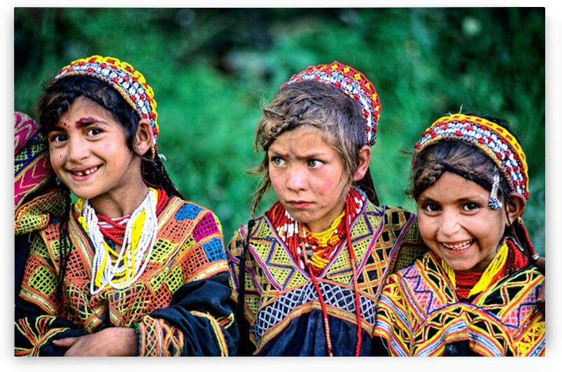 Kalash children in traditional dress in Bumburet Valley by Marco Brivio