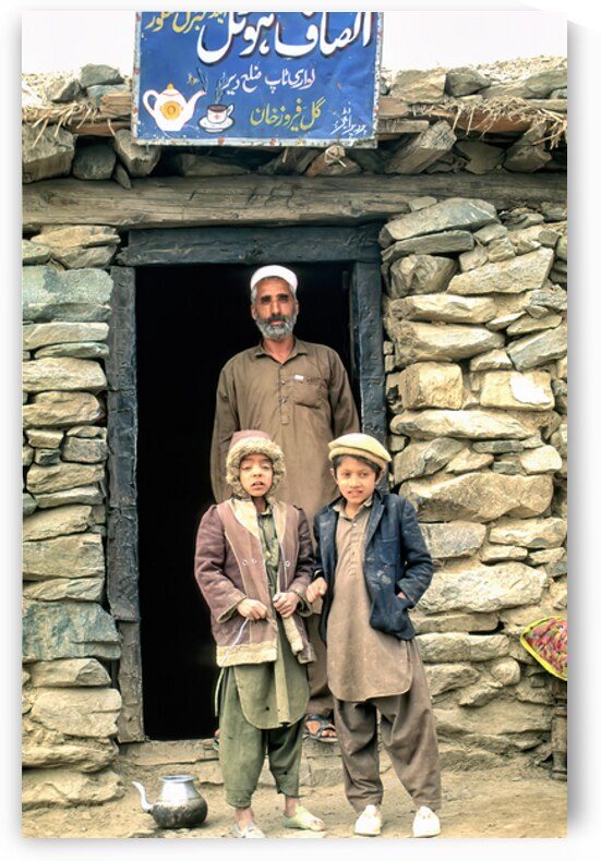 Family near shop at Shandur Pass in Pakistan by Marco Brivio