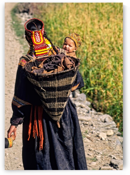 Life in kalash village of bumburet valley with a child by Marco Brivio