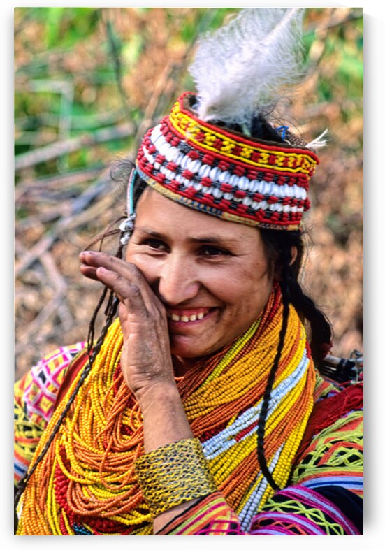 Kalash woman smiles at a cultural event in Pakistan by Marco Brivio