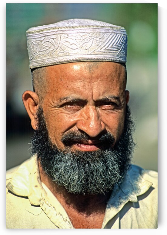 Portrait of a bearded man in Pakistan during daylight by Marco Brivio