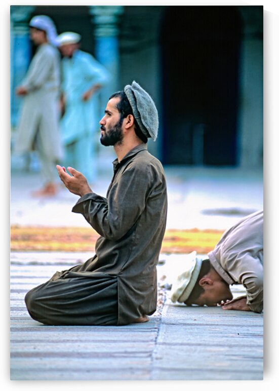Prayers in the mosque of Chitral Pakistan at sunset by Marco Brivio