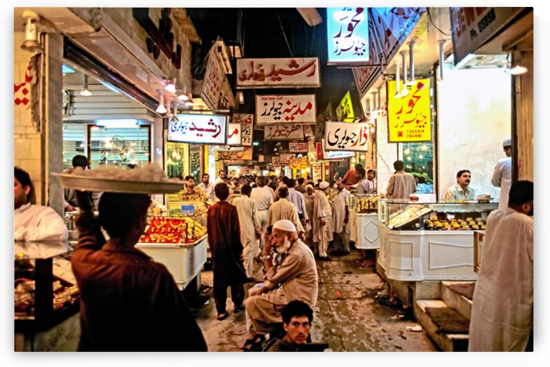 Night market in Lahore filled with vendors and shoppers by Marco Brivio
