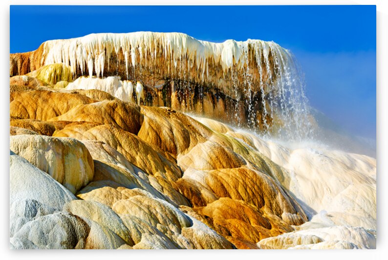 Steam rises from Devils Thumb in Yellowstone National Park by Marco Brivio