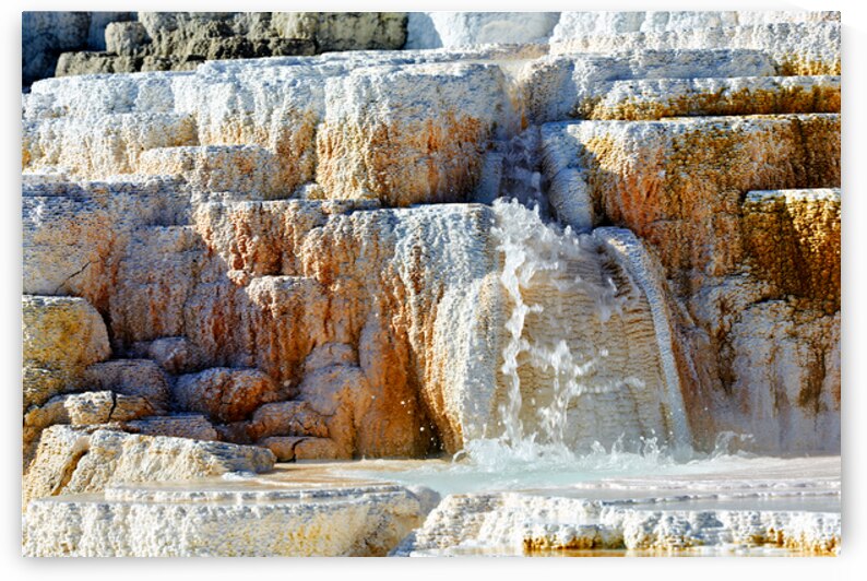 Water flowing over the terraces at Devils Thumb in Yellowstone by Marco Brivio