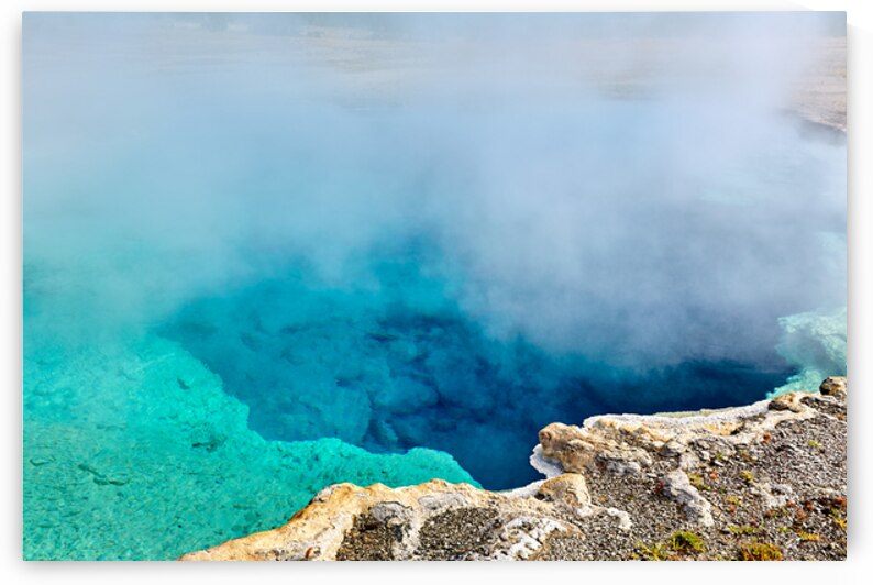 Sapphire Pool in Yellowstone National Park on a clear day by Marco Brivio