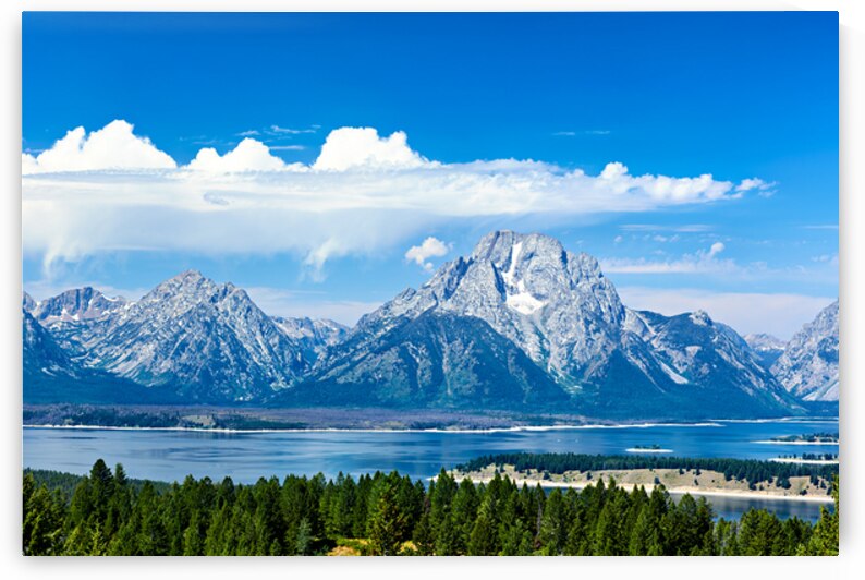 Mountains and lake in Grand Teton National Park during day by Marco Brivio