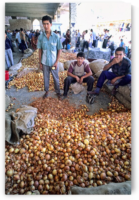 Young vendors sell onions in a market in Khiva Uzbekistan by Marco Brivio