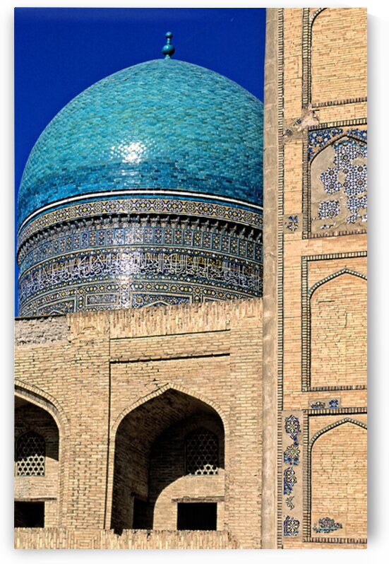 Bukhara features blue dome of historical mosque during daylight by Marco Brivio
