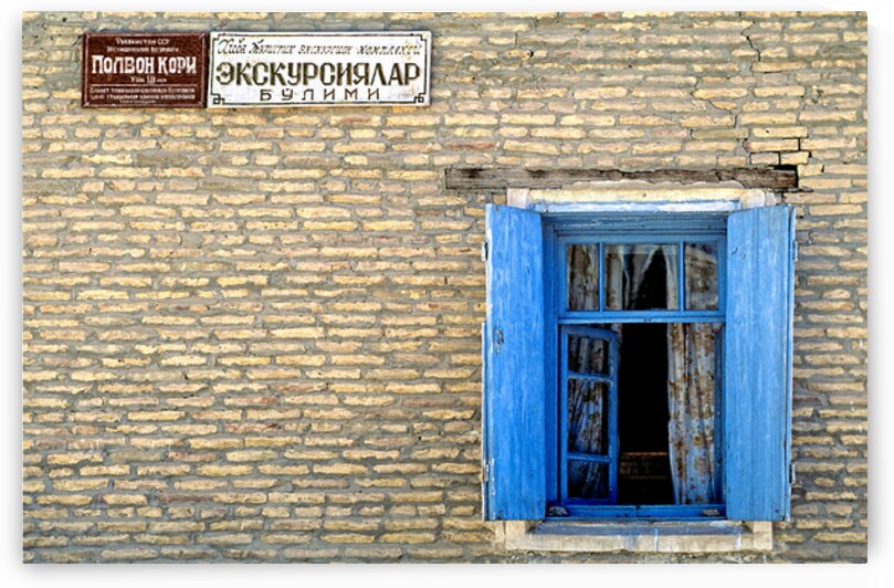Window view of a building in Khiva Uzbekistan during daytime by Marco Brivio