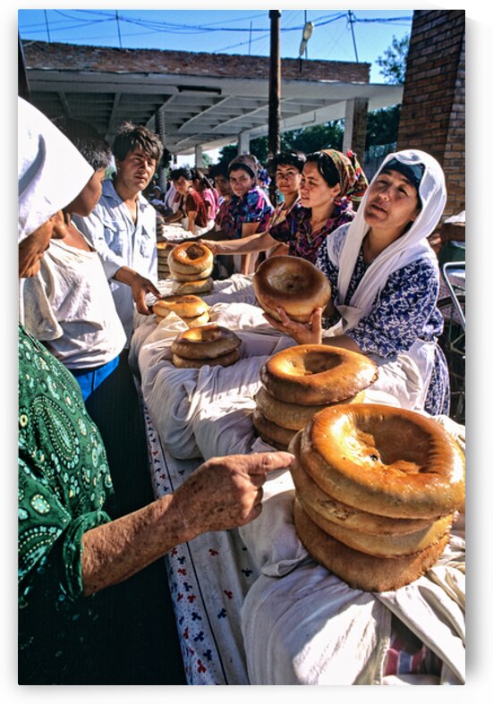 People selling bread at a market in Khiva Uzbekistan by Marco Brivio